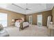 Spacious main bedroom with tray ceilings, carpet floors, and two large windows at 350 Covered Bridge Sw Pl, Smyrna, GA 30082