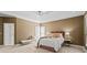 Spacious main bedroom with tray ceilings, carpet floors, and three large windows at 350 Covered Bridge Sw Pl, Smyrna, GA 30082