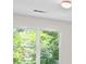 Bright room featuring a large window with a pleasant outdoor view of trees and foliage at 350 Covered Bridge Sw Pl, Smyrna, GA 30082