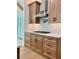 Kitchen cabinets, stainless steel appliances, white countertops and tiled backsplash at 409 Saint Surrey Way, Ellenwood, GA 30294