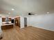 Open floor plan with hardwood floors, kitchen island, and ample space for entertaining at 409 Saint Surrey Way, Ellenwood, GA 30294