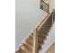 Modern staircase with wood treads, iron railing, and recessed lighting at 409 Saint Surrey Way, Ellenwood, GA 30294