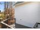 Side view of a wood stained outdoor deck and white home exterior at 4100 Devon Wood Ne Dr, Marietta, GA 30066