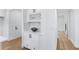 Elegant bar area with custom cabinets, wine rack, and marble countertops, perfect for entertaining at 4100 Devon Wood Ne Dr, Marietta, GA 30066