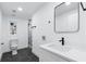 Bathroom featuring sleek black fixtures, stand alone shower, and modern dark hexagonal tile at 4100 Devon Wood Ne Dr, Marietta, GA 30066