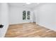 Bright bedroom with natural light showcases hardwood floors and a closet behind a double door at 4100 Devon Wood Ne Dr, Marietta, GA 30066