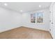 Neutral bedroom featuring hardwood floors, a window with outside view and closet at 4100 Devon Wood Ne Dr, Marietta, GA 30066