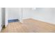 Bright bedroom featuring light colored wood floors, and a bright window at 4100 Devon Wood Ne Dr, Marietta, GA 30066