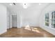 Bright bedroom with wood floors has vaulted ceiling and closet with double doors; natural light at 4100 Devon Wood Ne Dr, Marietta, GA 30066