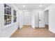 Light filled bedroom with hardwood floors, closet and windows with backyard views at 4100 Devon Wood Ne Dr, Marietta, GA 30066