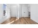 Hardwood floors accent this white bedroom that features a double door entry to a walk-in closet at 4100 Devon Wood Ne Dr, Marietta, GA 30066