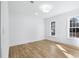 This room has a ceiling light, hardwood floors, white walls and trim, and natural light at 4100 Devon Wood Ne Dr, Marietta, GA 30066