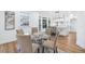 Bright dining area featuring hardwood floors, glass table, and contemporary furnishings near the kitchen at 4100 Devon Wood Ne Dr, Marietta, GA 30066