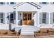 Inviting front porch with a double-door entrance, stylish planters, and classic gray shutters at 4100 Devon Wood Ne Dr, Marietta, GA 30066