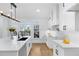 Modern kitchen featuring a large island with white cabinets, black hardware, and natural light at 4100 Devon Wood Ne Dr, Marietta, GA 30066