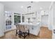 Beautiful white kitchen with large island, stainless steel appliances, and lots of natural light at 4100 Devon Wood Ne Dr, Marietta, GA 30066