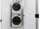 Convenient laundry area with stacked washer and dryer; a practical space-saving design and bright clean finish at 4100 Devon Wood Ne Dr, Marietta, GA 30066