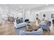 Open living space with hardwood floors and lots of light flowing into the seating, dining, and kitchen areas at 4100 Devon Wood Ne Dr, Marietta, GA 30066