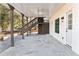Covered patio area featuring concrete pavers, a fan and access to backyard and home at 4100 Devon Wood Ne Dr, Marietta, GA 30066
