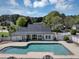 Aerial view of a large community pool and surrounding amenities with lush landscaping at 829 Verdun Way, Marietta, GA 30064
