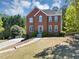 Aerial view of homes in a cul-de-sac surrounded by lush greenery and mature trees at 829 Verdun Way, Marietta, GA 30064