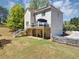 Backyard featuring a deck, covered patio, and garage, offering outdoor living and parking at 829 Verdun Way, Marietta, GA 30064