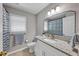Cozy bathroom with white cabinets, granite counters and tiled floor at 829 Verdun Way, Marietta, GA 30064