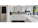 Bright bathroom with granite counters, white cabinets, modern fixtures, tub and separate shower at 829 Verdun Way, Marietta, GA 30064