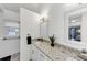 Bright bathroom with granite counters, white cabinets, brushed brass hardware, and modern fixtures at 829 Verdun Way, Marietta, GA 30064