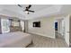 Primary bedroom includes ceiling fan, hardwood floors, natural light, and access to the ensuite bathroom at 829 Verdun Way, Marietta, GA 30064