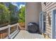Outdoor deck with wood flooring and white railings, provides a nice spot for grilling and relaxing at 829 Verdun Way, Marietta, GA 30064