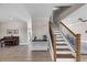 Welcoming entryway featuring a staircase, console table, hardwood floors, and access to living spaces at 829 Verdun Way, Marietta, GA 30064