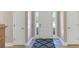 Inviting foyer featuring hardwood floors and a welcoming atmosphere with a patterned blue rug at 829 Verdun Way, Marietta, GA 30064