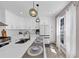Spacious kitchen with white cabinetry, a large island, stainless steel appliances, and natural light from the window at 829 Verdun Way, Marietta, GA 30064