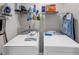 Functional laundry room with shelving above side-by-side washer and dryer at 829 Verdun Way, Marietta, GA 30064