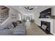 Spacious living room with fireplace, large TV, and cozy seating areas, and open staircase at 829 Verdun Way, Marietta, GA 30064