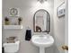 Elegant powder room with decorative mirror, sink, and a stylish decor at 829 Verdun Way, Marietta, GA 30064