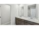 A bright bathroom featuring dual sinks, modern fixtures, and a white countertop exudes modern elegance at 1280 Firefly Field Trce, Lawrenceville, GA 30045