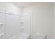 Bathroom with a white shower and a white toilet at 1280 Firefly Field Trce, Lawrenceville, GA 30045