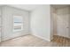 Cozy bedroom with a bright window, modern floors, and neutral paint at 1280 Firefly Field Trce, Lawrenceville, GA 30045
