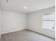 Bedroom with carpet flooring, neutral walls, and a large window at 1280 Firefly Field Trce, Lawrenceville, GA 30045