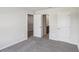 Bedroom with gray carpet, neutral walls and three doors at 1280 Firefly Field Trce, Lawrenceville, GA 30045