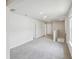 Hallway with carpet floors, white trim and a window with natural light at 1280 Firefly Field Trce, Lawrenceville, GA 30045