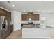 Well-equipped kitchen with granite island, stainless steel appliances and ample cabinet space at 1280 Firefly Field Trce, Lawrenceville, GA 30045