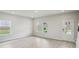 Bright, spacious living room with large windows and modern flooring at 1280 Firefly Field Trce, Lawrenceville, GA 30045