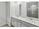 Bathroom vanity features double sinks and a glass-enclosed shower at 1290 Firefly Field Trce, Lawrenceville, GA 30045