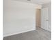 Bedroom with carpet and neutral paint and door to another area at 1290 Firefly Field Trce, Lawrenceville, GA 30045