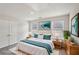 Virtually staged bedroom design features soft rug and contemporary artwork at 1290 Firefly Field Trce, Lawrenceville, GA 30045