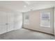 Bright bedroom with two windows and a closet door at 1290 Firefly Field Trce, Lawrenceville, GA 30045