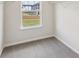 Carpeted walk-in closet features white shelving at 1290 Firefly Field Trce, Lawrenceville, GA 30045